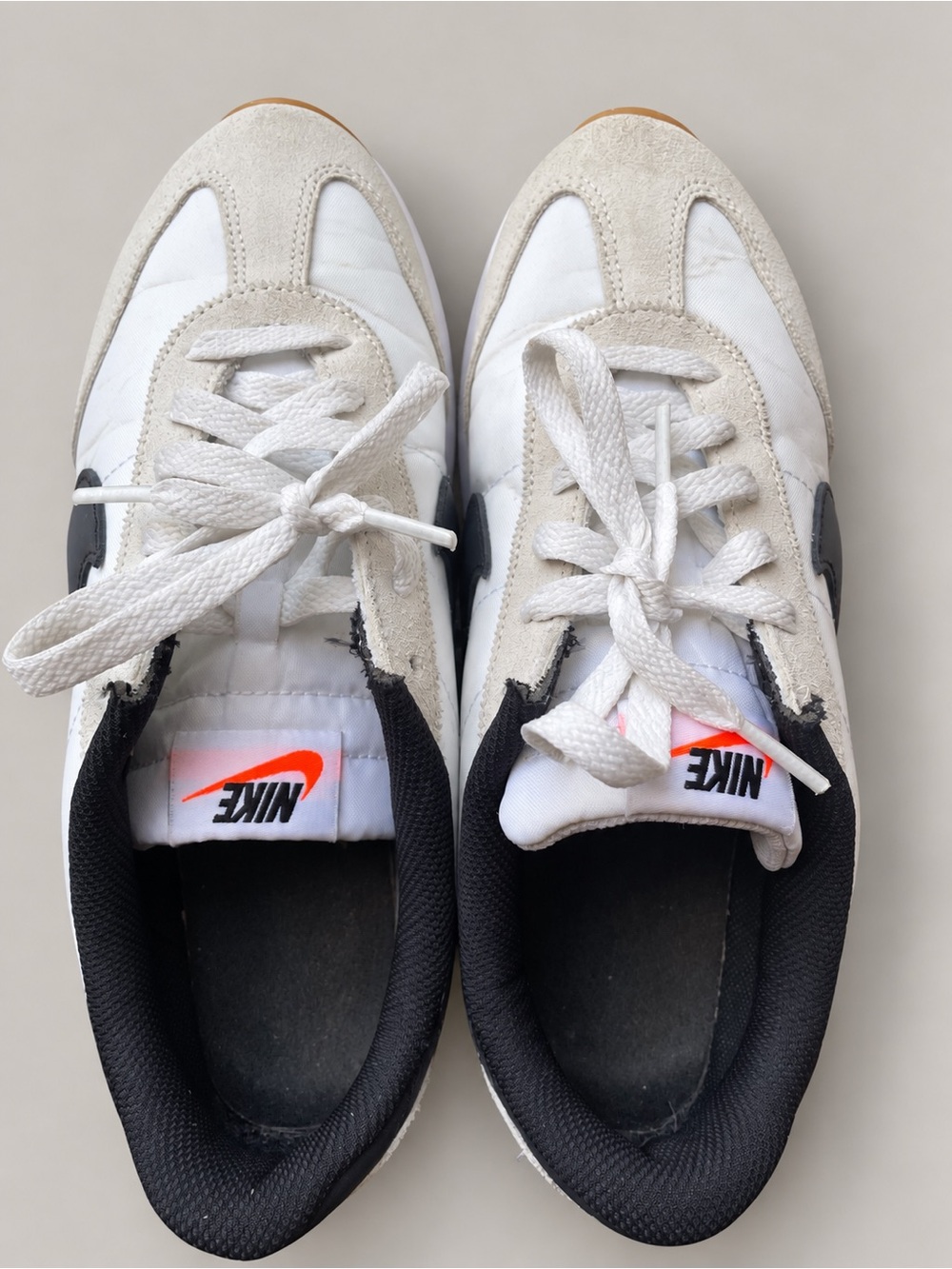 Nike White and Black Low-Top Retro Sneakers with Orange Logo
